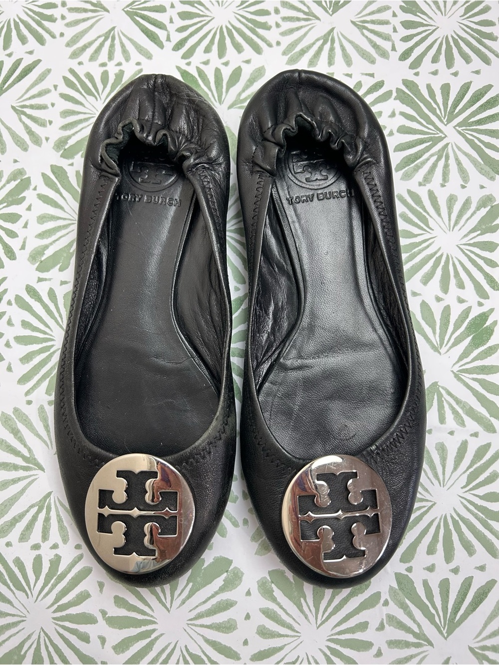 Tory Burch Black Leather Logo Ballet Flats with Silver Emblem